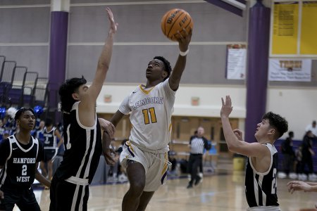 Lemoore's Jasean Gardner looks to scored against West.